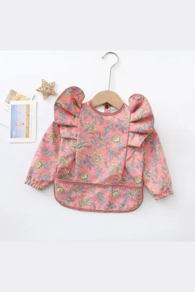Pechera o babero impermeable con mangas y vuelos - Imagen 3